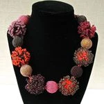 Zulu  Bead Necklace - Pom-poms: burgundy,coral,pink, gold. 