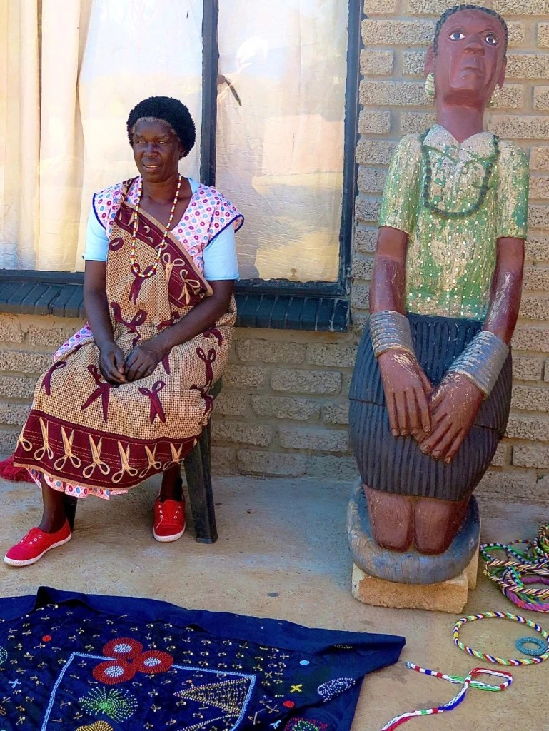 Shangaan woman with carving
